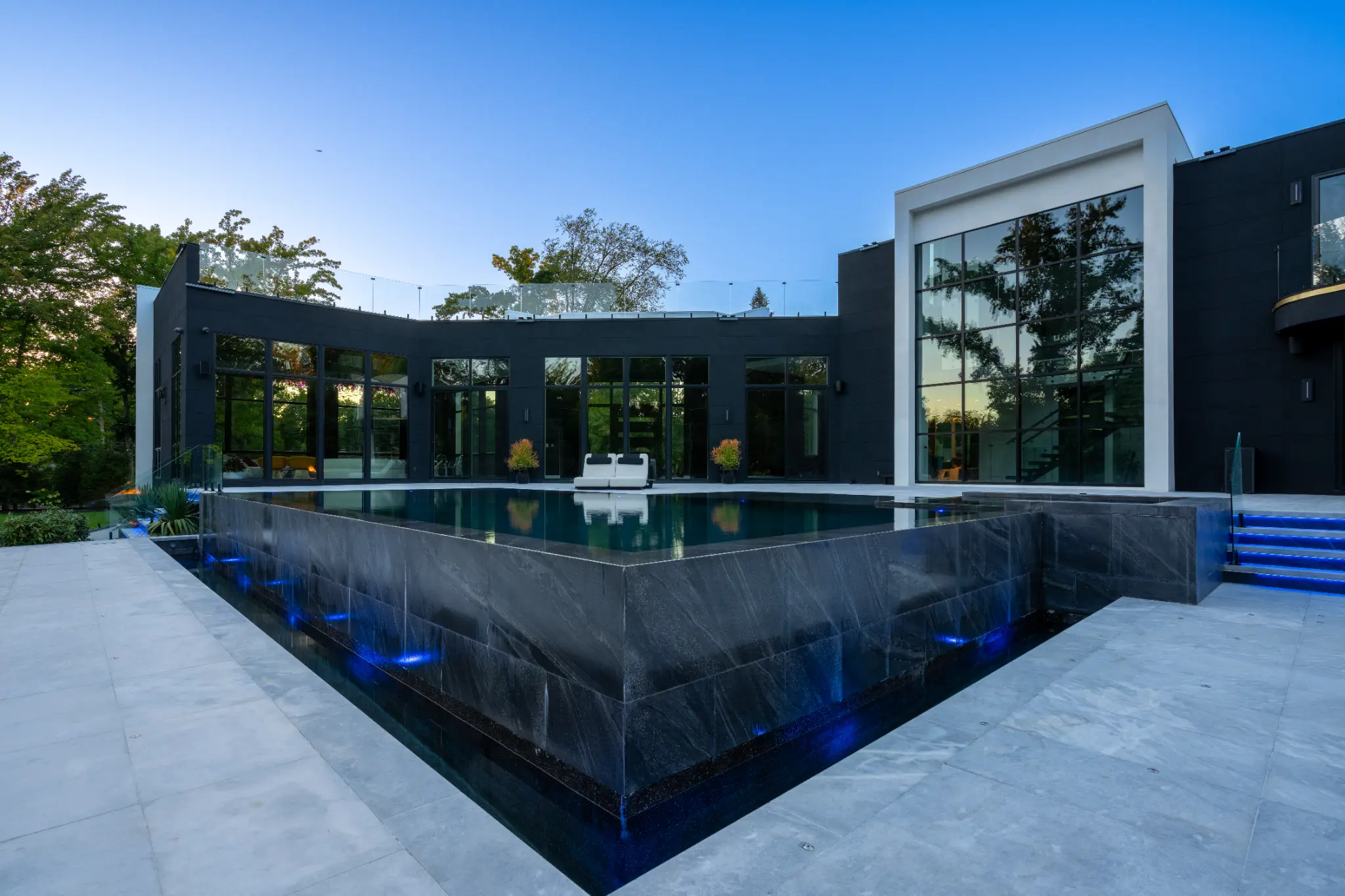 Low perspective across the reflective pool edge at the Kings Point project